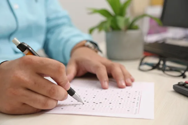 test paper, answering, hand, note, filling sheet, filling form, test paper, test paper, test paper, test paper, test paper. MBTI explorers misconceptions: what the S and the P claim